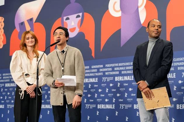 25 02 2023,Berlin,Germany,73 Berlin International Film Festival Director Amr Gamal is awarded the Amnesty Film Prize for his film Al Murhaqoon by Amnesty Jury Members Lea van Acken, Burhan Qurbani and Markus N Beeko.