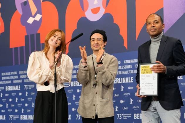25 02 2023,Berlin,Germany,73 Berlin International Film Festival Director Amr Gamal is awarded the Amnesty Film Prize for his film Al Murhaqoon by Amnesty Jury Members Lea van Acken, Burhan Qurbani and Markus N Beeko.