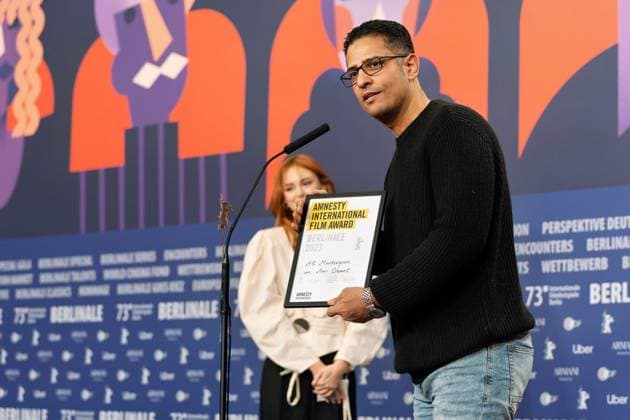 25 02 2023,Berlin,Germany,73 Berlin International Film Festival Director Amr Gamal is awarded the Amnesty Film Prize for his film Al Murhaqoon by Amnesty Jury Members Lea van Acken, Burhan Qurbani and Markus N Beeko.