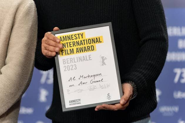 25 02 2023,Berlin,Germany,73 Berlin International Film Festival Director Amr Gamal is awarded the Amnesty Film Prize for his film Al Murhaqoon by Amnesty Jury Members Lea van Acken, Burhan Qurbani and Markus N Beeko.