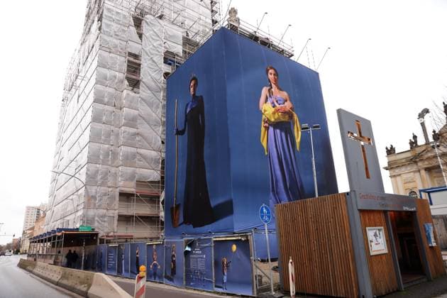 Portrait photos of Ukrainian refugee women by artist Julia Krahn hang in the exhibition St Javelin at the construction site for the reconstruction of the tower of the Garrison Church in Potsdam, 25 February 2023 The exhibition runs until 9 April 2023 Construction Site Garrison Church Potsdam Exhibition St Javelin