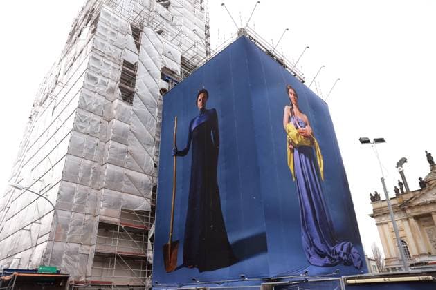 Portrait photos of Ukrainian refugee women by artist Julia Krahn hang in the exhibition St Javelin at the construction site for the reconstruction of the tower of the Garrison Church in Potsdam, 25 February 2023 The exhibition runs until 9 April 2023 Construction Site Garrison Church Potsdam Exhibition St Javelin