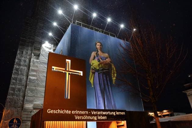 Portrait photos of Ukrainian refugee women by artist Julia Krahn hang in the exhibition St Javelin at the construction site for the reconstruction of the tower of the Garrison Church in Potsdam, 25 February 2023 The exhibition runs until 9 April 2023 Construction Site Garrison Church Potsdam Exhibition St Javelin