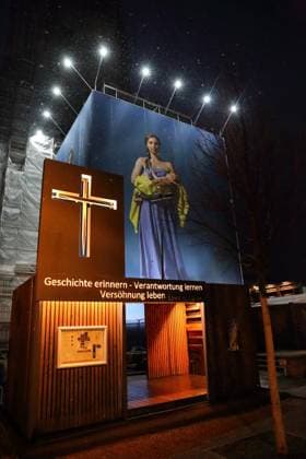 Portrait photos of Ukrainian refugee women by artist Julia Krahn hang in the exhibition St Javelin at the construction site for the reconstruction of the tower of the Garrison Church in Potsdam, 25 February 2023 The exhibition runs until 9 April 2023 Construction Site Garrison Church Potsdam Exhibition St Javelin