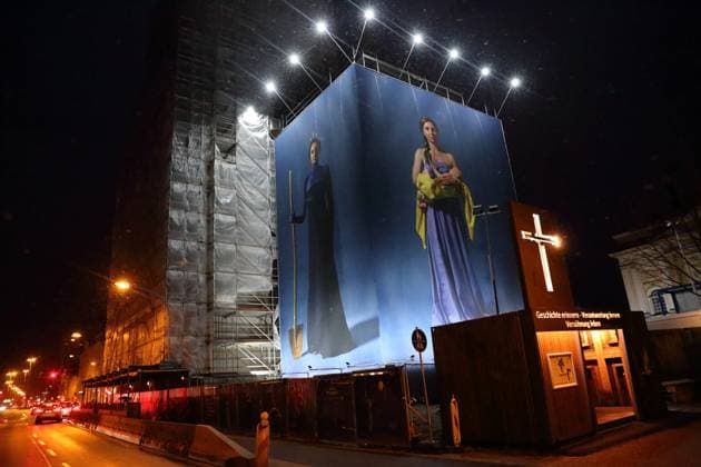 Portrait photos of Ukrainian refugee women by artist Julia Krahn hang in the exhibition St Javelin at the construction site for the reconstruction of the tower of the Garrison Church in Potsdam, 25 February 2023 The exhibition runs until 9 April 2023 Construction Site Garrison Church Potsdam Exhibition St Javelin