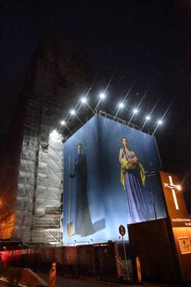 Portrait photos of Ukrainian refugee women by artist Julia Krahn hang in the exhibition St Javelin at the construction site for the reconstruction of the tower of the Garrison Church in Potsdam, 25 February 2023 The exhibition runs until 9 April 2023 Construction Site Garrison Church Potsdam Exhibition St Javelin