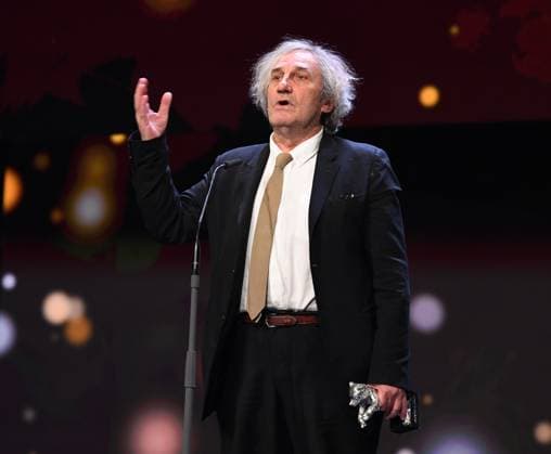(230226) -- BERLIN, Feb. 26, 2023 -- Philippe Garrel, director of the film The Plough , speaks after receiving the Silver Bear for Best Director during the 73rd Berlin International Film Festival in Berlin, Germany, Feb. 25, 2023. ) GERMANY-BERLIN-BERLINALE 2023-AWARDS RenxPengfei 