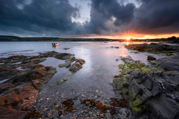 The sun rising over Newport in Pembrokeshire. Copyright: xLoopxImages MarkxBauerx MBR03822122
