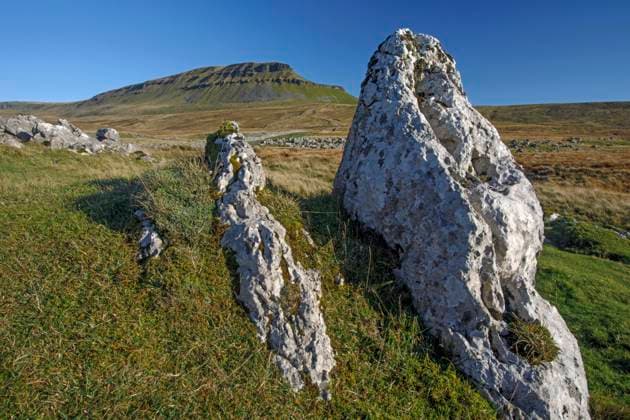 Penyghent and eroded limestone rocks above Ribblesdale. Copyright: xLoopxImages GranvillexHarrisx GRH00523016