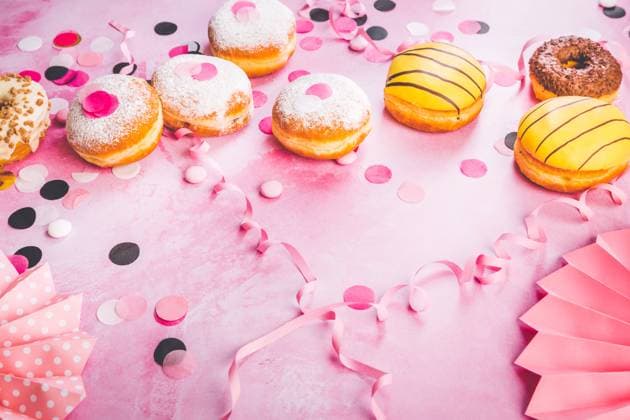 Traditional Berliner for carnival and party. German Krapfen or donuts with streamers and confetti. Colorful carnival or birthday image Traditional Berliner for carnival and party. German Krapfen or donuts with streamers and confetti. Colorful carnival or birthday image Copyright: xZoonar.com IngridxBalabanovax 19507373