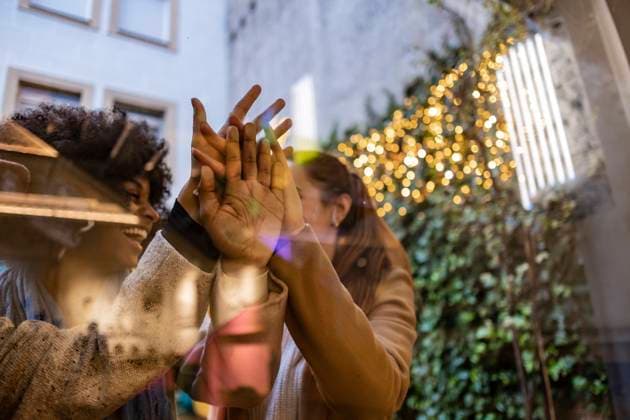 Multiracial friends standing in unity seen through glass model released, Symbolfoto property released, JCCMF08662