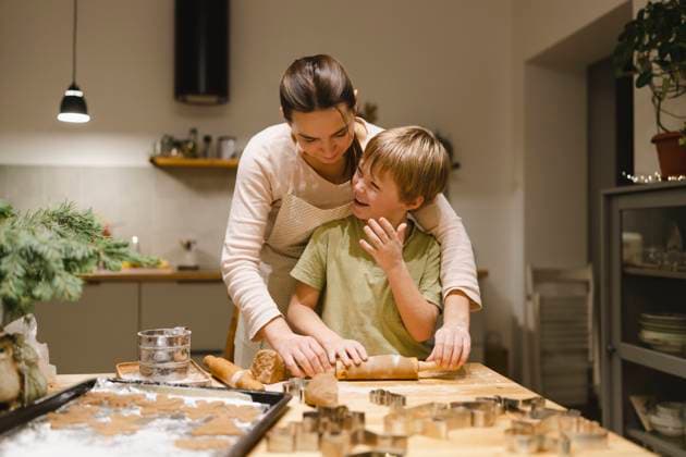 Happy son making ginger cookies with mother in kitchen model released, Symbolfoto property released, VBUF00257