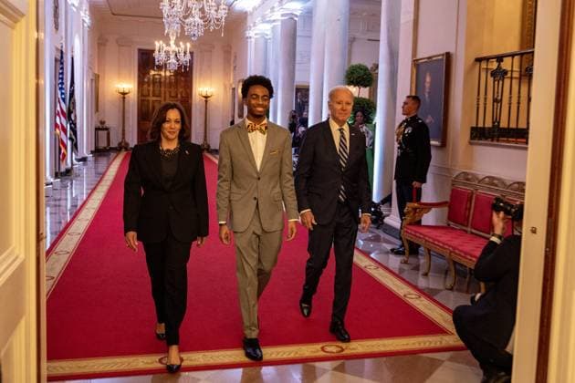 Vice President Kamala Harris, DuWayne Portis Jr. and President Joe Biden walk deliver remarkss at reception celebrating Black History month in the East Room of the White House in Washington, D.C. on Monday, February 27, 2023.  WAP2023027015 TASOSxKATOPODIS