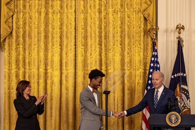 President Joe Biden greets DuWayne Portis Jr after delivering remarks at reception celebrating Black History month with Vice President Kamala Harris in the East Room with of the White House in Washington, D.C. on Monday, February 27, 2023.  WAP2023027024 TASOSxKATOPODIS