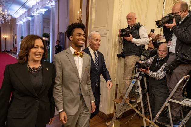 Vice President Kamala Harris, DuWayne Portis Jr. and President Joe Biden walk deliver remarkss at reception celebrating Black History month in the East Room of the White House in Washington, D.C. on Monday, February 27, 2023.  WAP2023027016 TASOSxKATOPODIS
