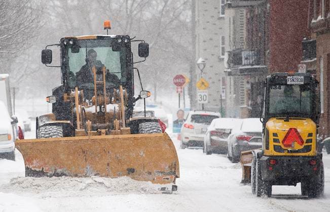 February 28, 2023, Montreal, PQ, Canada: A plow clears a street during a snowstorm in Montreal, Tuesday, Feb. 28, 2023. Montreal Canada  - ZUMAc35_ 20230228_zaf_c35_011 Copyright: xGrahamxHughesx