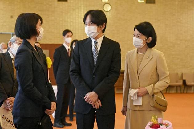Japan crown prince at award ceremony Japanese Crown Prince Fumihito and Princess Kiko chat with an awardee (L) after attending an award ceremony for 18 promising young researchers, including those studying at graduate schools, at the Japan Academy headquarters building in Tokyo on March 2, 2023. (Pool photo)  A14AA0001401383P