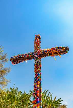 Crucifix decorated with flowers with blue sky in the background Crucifix decorated with flowers with blue sky in the background common in traditional religious festivals in the interior of Brazil in the state of Minas Gerais Copyright: xZoonar.com FredxPinheirox 17807436