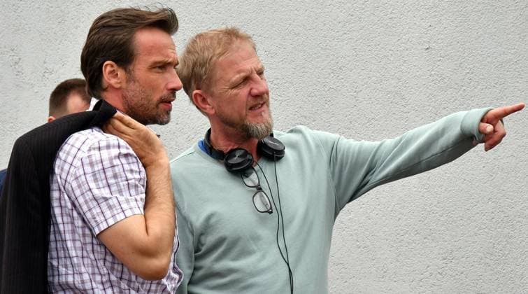 Sönke Wortmann dreht Film mit ca. 150 Komparsen Verfilmung von Frank Goosens Roman Sommerfest. *** NUR FÜR REDAKTIONELLE ZWECKE *** EDITORIAL USE ONLY ***<p>Sönke Wortmann (im Bild zusammen mit Hauptdarsteller Lucas Gregorowicz, links) dreht Film mit ca. 150 Komparsen Verfilmung von Frank Goosens Roman Sommerfest, gedreht wird unter anderem am Dienstag, dem 21.06.2016 auf dem Sportplatz Dickebankstraße in Bochum Wattenscheid. Deutschland NW Wattenscheid Copyright: GeroxHelm *** Sönke Wortmann rotates Film with Ca 150 Extras Film adaptation from Frank goosens Novel Summer Festival *** ONLY FOR EDITORIAL PURPOSE *** EDITORIAL USE ONLY *** P Sönke Wortmann at Picture together with leading actor Lucas Gregorowicz, left rot Copyright: GeroxHelm docnrwhugopicture106643933 EDITORIAL USE ONLY