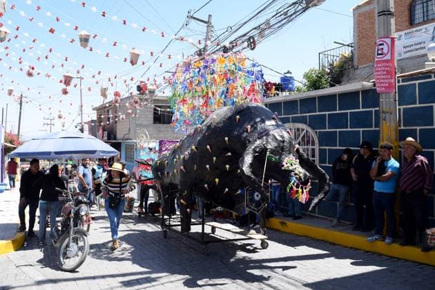Monumental Cardboard Exhibition During International Fireworks Fair 08 March 2023, Tultepec, Mexico: Persons attend at monumental cardboard figures exhibition as part of the International Fireworks Fair 2023 (IFF), festival in honor of Saint John of God, saint of fireworks. The bulls are paper mache and cardboard. Since morning they parade through the streets and compete for the bull with the best design. on March 12, 2023 in Tultepec, Mexico. (Photo: Francisco Morales Eyepix Group) Copyright: xFranciscoxMorales xEyepixxGroupx DM_9002_FM_6433