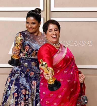 (L-R) Kartiki Gonsalves and Guneet Monga, winners of the award for Best Documentary Short Subject for The Elephant Whisperers, appear backstage with their Oscars during the 95th annual Academy Awards at Loews Hollywood Hotel in the Hollywood section of Los Angeles on Sunday, March 12, 2023.  LAP20230312209 JOHNxANGELILLO