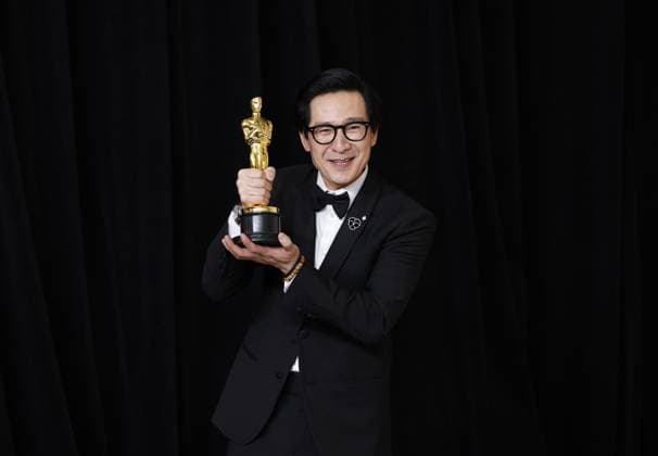 Ke Huy Quan winner of the Best Supporting Actor, for Everything Everywhere All at Once appears backstage with an Oscar during the 95th annual Academy Awards at Loews Hollywood Hotel in the Hollywood section of Los Angeles on Sunday, March 12, 2023.  LAP202303128004 JohnxAngelillo