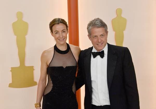(L-R) Anna Eberstein and Hugh Grant attend the 95th annual Academy Awards at the Dolby Theatre in the Hollywood section of Los Angeles on Sunday, March 12, 2023.  LAP2023031211282 JIMxRUYMEN