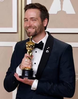 Paul Rogers, winner of the award for Best Film Editing for Everything Everywhere All at Once, appears backstage with his Oscar during the 95th annual Academy Awards at Loews Hollywood Hotel in the Hollywood section of Los Angeles on Sunday, March 12, 2023.  LAP20230312268 JOHNxANGELILLO