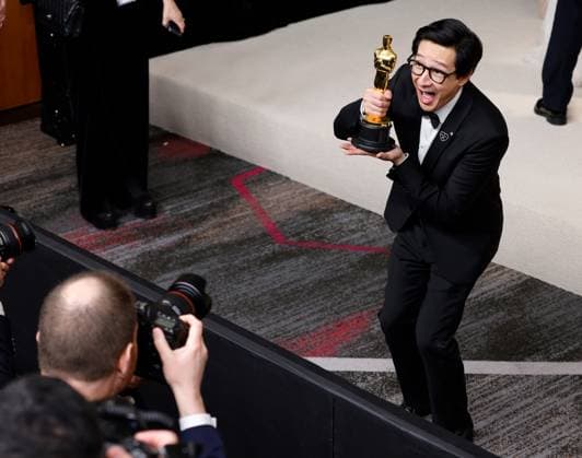 Ke Huy Quan, winner of the award for Best Actor In A Supporting Role for Everything Everywhere All at Once???, appears backstage with his Oscar during the 95th annual Academy Awards at Loews Hollywood Hotel in the Hollywood section of Los Angeles on Sunday, March 12, 2023.  LAP20230312283 JOHNxANGELILLO