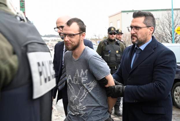 March 14, 2023, AMQUI, PQ, Canada: Steeve Gagnon is escorted by police into court in Amqui, Que., Tuesday, March 14, 2023. Gagnon is facing charges relating to an incident where a driver of a pickup truck drove into pedestrians, killing two people and injuring nine. AMQUI Canada  - ZUMAc35_ 20230314_zaf_c35_099 Copyright: xJacquesxBoissinotx