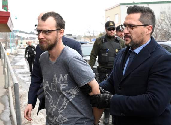 March 14, 2023, AMQUI, PQ, Canada: Steeve Gagnon is escorted by police into court in Amqui, Que., Tuesday, March 14, 2023. Gagnon is facing charges relating to an incident where a driver of a pickup truck drove into pedestrians, killing two people and injuring nine. AMQUI Canada  - ZUMAc35_ 20230314_zaf_c35_101 Copyright: xJacquesxBoissinotx