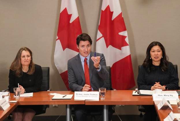 March 16, 2023, TORONTO, ON, CANADA: Canadian Prime Minister Justin Trudeau, centre, sits with Mary NG, right, Minister of International Trade, Export Promotion, Small Business & Economic Development and Chrystia Freeland, Canada s Deputy Prime Minister and Minister of Finance as they attend the NAFTA Advisory Council Meeting in Toronto, Thursday, March 16, 2023. TORONTO CANADA - ZUMAc35_ 20230316_zaf_c35_051 Copyright: xNathanxDenettex