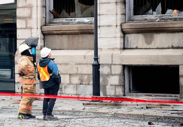 March 18, 2023, Montreal, PQ, Canada: Investigators and firefighters survey the scene following a fire in Old Montreal, Saturday, March 18, 2023, that gutted the heritage building. Montreal Canada  - ZUMAc35_ 20230318_zaf_c35_002 Copyright: xGrahamxHughesx