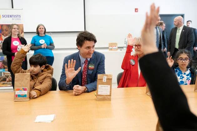 March 18, 2023, Aurora, ON, Canada: Prime Minister Justin Trudeau sits next to Arteen Golizadeh (left) as he does science based crafts with children during a Nowruz celebration with members of the Persian community, in Aurora, Ont., on Saturday, March 18, 2023. Aurora Canada  - ZUMAc35_ 20230318_zaf_c35_063 Copyright: xChrisxYoungx