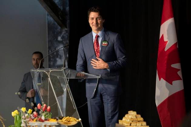 March 18, 2023, Aurora, ON, Canada: Prime Minister Justin Trudeau speaks from a podium placed next to a table displaying a Ã’Haft-sinO as he attends a Nowruz celebration with members of the Persian community, in Aurora, Ont., on Saturday, March 18, 2023. Aurora Canada  - ZUMAc35_ 20230318_zaf_c35_067 Copyright: xChrisxYoungx