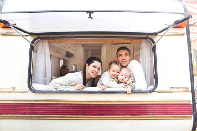 Portrait of the smiling happy family with kids in the house on wheels Portrait of the smiling happy family with kids in the house on wheels indoor ,model released, Symbolfoto Copyright: xZoonar.com DashaxPetrenkox 15607512 ,model released, Symbolfoto ,property released