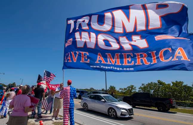 March 21, 2023, West Palm Beach, Florida, US: March 21, 2023, West Palm Beach, Florida: Donald Trump supporters rally in front of Trump s private club and residence, Mar-a-Lago, while awaiting the former president s possible indictment for misdemeanor fraud in New York over hush money payments to adult film star, Stormy Daniels. West Palm Beach US - ZUMAg216 20230321_znp_g216_012 Copyright: xDominicxGwinnx