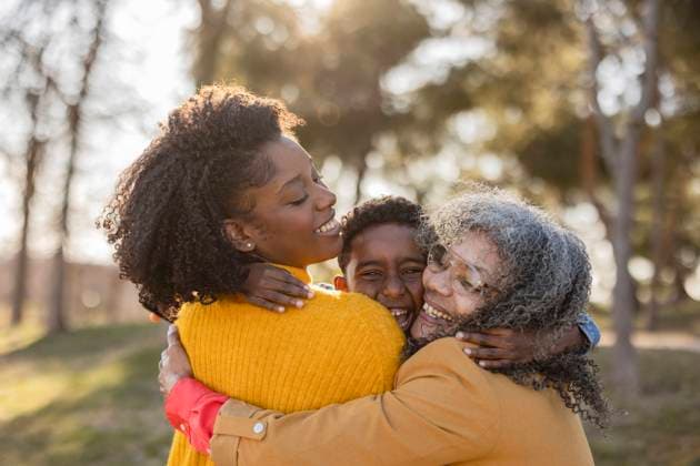 Happy multi-generation family embracing and having fun in park model released, Symbolfoto, JCCMF09899