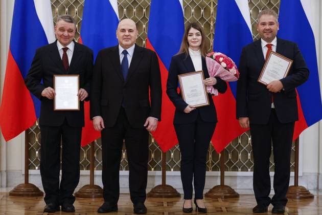 RUSSIA, MOSCOW - MARCH 24, 2023: Rosconcert Touring Director Vladimir Cherkasov, Russia s Prime Minister Mikhail Mishustin, Rosconcert Deputy Touring Director Yulia Zaitseva, and Rosconcert CEO Andrei Malyshev (L-R) pose during a ceremony at the House of the Government to present national awards in the field of culture for 2022. Dmitry Astakhov POOL TASS  58044695