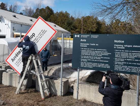 March 24, 2023, Champlain, New York, United States: Workers remove current warning signs at the irregular border at Roxham Road from New York into Canada on Friday, March 24, 2023 in Champlain, N.Y. Champlain United States  - ZUMAc35_ 20230324_zaf_c35_131 Copyright: xRyanxRemiorzx