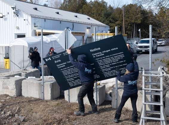 March 24, 2023, Champlain, New York, United States: Workers remove current warning signs at the irregular border at Roxham Road from New York into Canada on Friday, March 24, 2023 in Champlain, N.Y. Champlain United States  - ZUMAc35_ 20230324_zaf_c35_205 Copyright: xRyanxRemiorzx