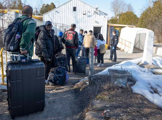 March 24, 2023, Champlain, New York, United States: Asylum seekers cross the border at Roxham Road from New York into Canada on Friday, March 24, 2023 in Champlain, N.Y. The irregular border crossing will be closed permanently tonight at midnight. Champlain United States  - ZUMAc35_ 20230324_zaf_c35_210 Copyright: xRyanxRemiorzx