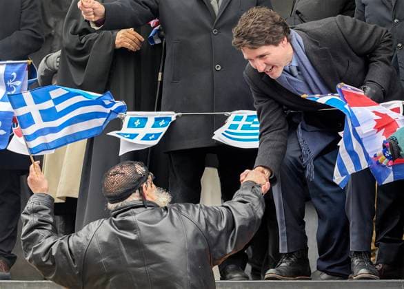 March 26, 2023, Montreal, PQ, Canada: Prime Minister Justin Trudeau shakes hands with a man as he attends the Greek Independence Day Parade in Montreal, Sunday, March 26, 2023. Montreal Canada  - ZUMAc35_ 20230326_zaf_c35_025 Copyright: xGrahamxHughesx