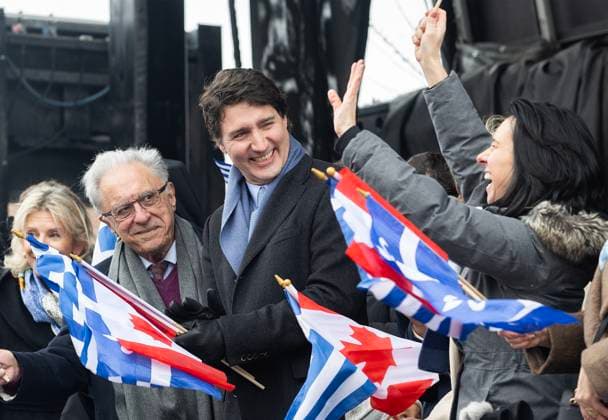 March 26, 2023, Montreal, PQ, Canada: Prime Minister Justin Trudeau, centre, looks on as Montreal Mayor Valerie Plante, right, waves to the crowd as they attend the Greek Independence Day Parade in Montreal, Sunday, March 26, 2023. Montreal Canada  - ZUMAc35_ 20230326_zaf_c35_029 Copyright: xGrahamxHughesx