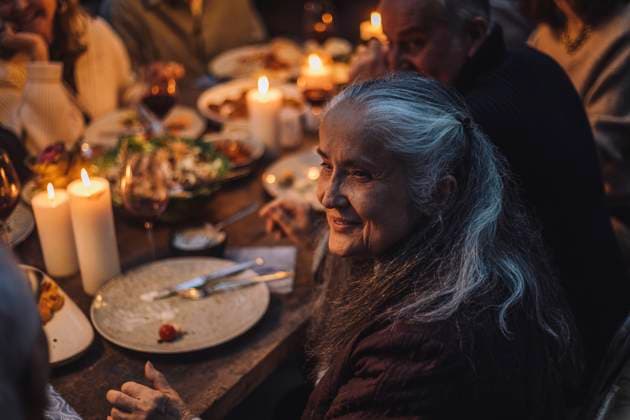 Smiling senior woman looking away during dinner party Sweden, Stockholm, model released, property released Copyright: xMaskotx , MA100253 MA100253