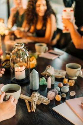 Sage and variety of crystals arranged on dining table at retreat center Sweden, Stockholm, model released, property released Copyright: xMaskotx , MA100427 MA100427