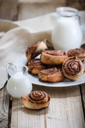 Cinnamon rolls Cinnamon rolls on a plate on a wooden background Copyright: xZoonar.com BurakovaxIrinax 13341197