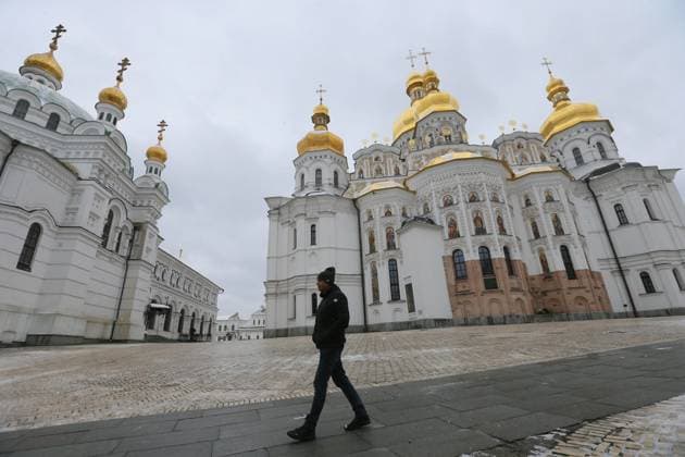 Kyiv Pechersk Lavra In Kyiv, Amid Russian Invasion Of Ukraine A man walks in front of Holy Dormition Cathedral of the Kyiv Pechersk Lavra, also known as the Kyiv Monastery of the Caves, in Kyiv, Ukraine on 29 March 2023, amid Russian invasion of Ukraine. Reserve Kyiv-Pechersk Lavra terminates the lease agreement with the Ukrainian Orthodox Church accused of being linked to the Moscow Patriarchate, with the demand to move out of the monastery by 29 March, as local media reported. Since its foundation as the cave monastery in 1051, the Lavra has been a preeminent center of Eastern Orthodox Christianity in Eastern Europe. Together with the Saint Sophia Cathedral, the Kyiv Pechersk Lavra has been inscribed as a UNESCO World Heritage Site si  Copyright: xSTRx originalFilename: sindeyev-notitle230329_npql4.jpg