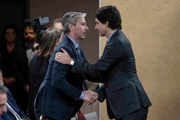 March 30, 2023, Truro, NS, Canada: Prime Minister Justin Trudeau, right, is greeted by Nova Scotia Premier Tim Houston prior to the final report of the Mass Casualty Commission inquiry into the mass murders in rural Nova Scotia in Truro, N.S. on Thursday, March 30, 2023. Truro Canada  - ZUMAc35_ 20230330_zaf_c35_010 Copyright: xDarrenxCalabresex