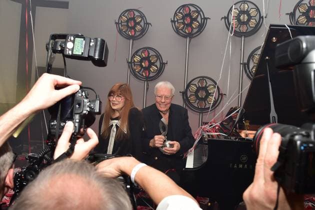 German Music Authors Award 2023 Christian Bruhn for his lifes work, Katja Ebstein, laudator at the piano surrounded by voelen photographers to the 14 award ceremony, German Music Authors Award 2023 on 30 March in Berlin Photopress Mueller